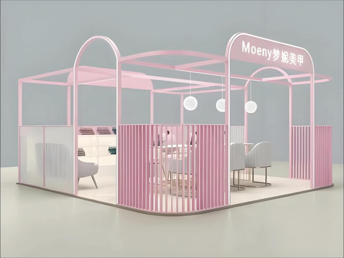 Mall atrium nail salon with ins-style pink modular design, semi-transparent slat partitions, and a combined nail service and product display kiosk.